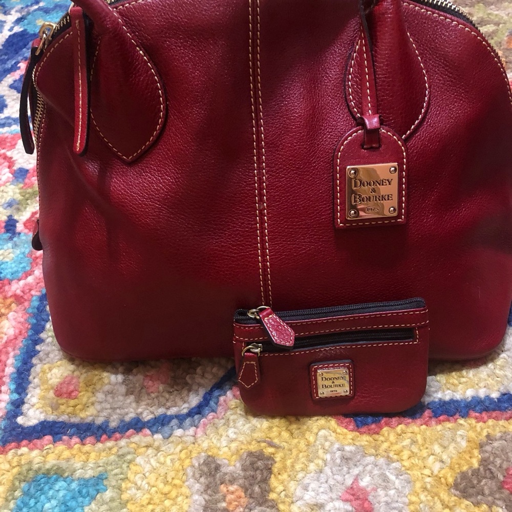 Dooney & Bourke Red Leather Satchel with Dome Shape. Includes small coin wallet.